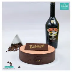 A sophisticated dessert for a refined palate. This is my Tiramisu cake, infused with Baileys Irish Cream for an extra layer of flavour, and topped with a dusting of cocoa and a chocolate plaque.