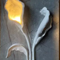 Here, I combined sculpture with function. This 3D floral wall art features hand-sculpted calla lilies on a stone-textured base, with integrated lighting that casts a warm, elegant glow, turning the wall into a statement piece.