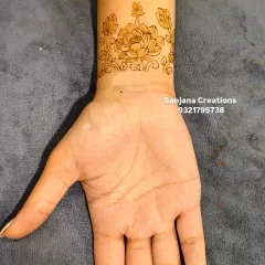 Here is the completed engagement wristband, with delicate floral vines extending from the central lotus. This style is very popular for clients who want something graceful but not overpowering.