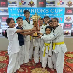 The pure joy of a team victory. Here, our young champs celebrate winning the overall trophy at the 1st Warriors Cup Open Taekwondo Championship. This is what our family spirit is all about.