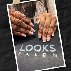 A beautiful combination for a bride or wedding guest. This classic French manicure on squared nails looks stunning alongside traditional henna, creating a perfect blend of modern and cultural styles.