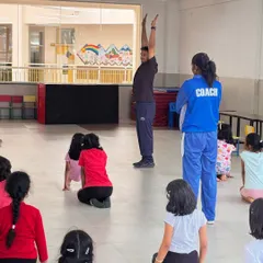 Leading by example is a core part of my teaching. I often demonstrate the correct posture and form alongside my assistant coaches to give students a clear visual guide.