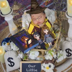 "Our Little Wizard." This Harry Potter themed newborn shoot is filled with magical details, from the sorting hat and glasses to a tiny book of spells. It’s a perfect theme for fans of the wizarding world.