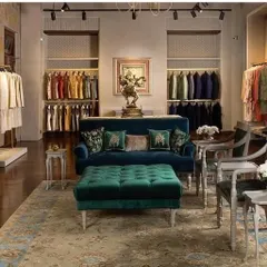 A seating area I created for a luxury retail boutique. The deep blue velvet sofa and tufted ottoman were designed to provide a comfortable and opulent experience for shoppers.