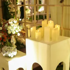 Soft candlelight creates a romantic and serene ambiance. I used a collection of flameless pillar candles and small floral bouquets to style this corner, adding a gentle glow to the evening.