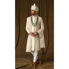 Another angle of the pearl ivory sherwani, highlighting the intricate craftsmanship and the elegant fall of the fabric. This is timeless beauty, redefined for the modern groom.