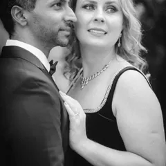 A candid black and white portrait where the couple is looking away from the camera. This creates a sense of a stolen, natural moment during their elegant pre-wedding photoshoot.