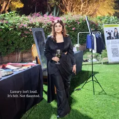 I believe luxury is a feeling, not a label. It's about how you carry yourself and the quiet confidence your style projects. This look, featuring a black cutout power suit, embodies my philosophy of "aspirational distance" where elegance commands attention without demanding it.