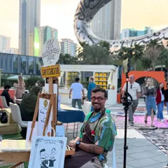 All set up and ready to 'Carry the Caricature' in Dubai. It's a thrill to bring my art to such a dynamic and international city.