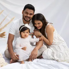 A serene family portrait in all white. This timeless and elegant look creates a feeling of unity and peace, perfect for capturing your family's bond.