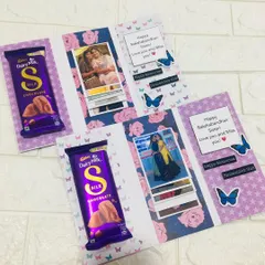 These are special Rakhi cards I designed for sisters to give to each other. They include a Dairy Milk Silk chocolate and a pull-out strip that reveals a series of memorable photos.