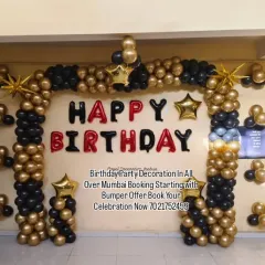 A bold and stylish black and gold balloon arch. The "HAPPY BIRTHDAY" foil letters stand out against the arch, making it a great backdrop for photos at an 18th, 21st, or 30th birthday party.