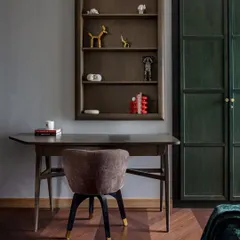 This elegant study nook, featuring a custom-built desk and shelving, is a product of our DCA Workshop. We focus on creating pieces that are not only beautiful but also perfectly integrated into the architectural language of the home.