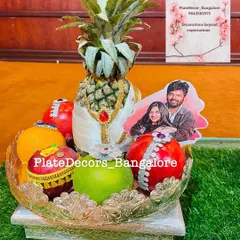 A personalized wedding platter featuring a pineapple groom and a custom photo cutout of the couple. I can incorporate your photos to make the gifts truly unique.