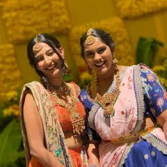 A happy client moment featuring my orange silk skirt set. The skirt has a hand-painted border and is paired with an embroidered blouse and a stunning Kashmiri embroidered georgette dupatta.
