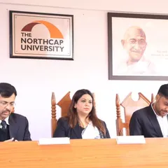 Focused on the proceedings during the moot court finals. Evaluating the students' reasoning and providing constructive feedback is a challenging but rewarding part of being a judge.