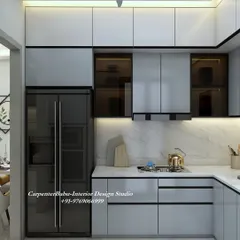 A modern kitchen with grey cabinets and a built-in refrigerator and oven. The design is sleek and efficient, with a marble-finish backsplash adding a touch of luxury.