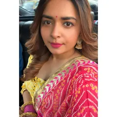 A close-up of my Diwali glam. The look is all about the details, from the traditional jhumka earrings to the bright pink lip.