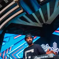 Sharing the stage with another artist during a trap music set. I enjoy collaborating on themed nights to bring a unique and powerful energy to the club.