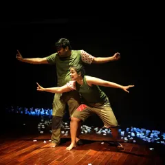 The two performers from "Gretel" in a moment of synchronized movement. This adaptation of the classic fairytale explodes with energy, mime, and absurdity.
