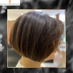 This bob hairstyle features shimmering spun gold highlights. It's a classic, chic look that is elevated by the perfect touch of color.