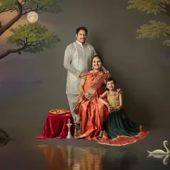 An artistic edit of a traditional family maternity shoot. The addition of a swan and water reflections transforms the portrait into a magical, dream-like scene.