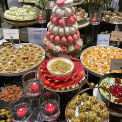 A closer look at the details. This grazing table for Manish Malhotra's store featured a macaron tower, pistachio-crusted cheese balls, and fresh watermelon with a yogurt dip.
