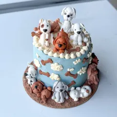 This cake is one of my all-time favorites, made for a true dog lover. It features a variety of handmade fondant dog figurines, each with its own personality, sitting on and around a buttercream cake. It’s a perfect example of how we can turn your passion into a delicious piece of edible art.