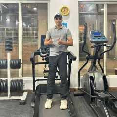 A post-workout photo on the treadmill. I believe in leading by example and staying fit year-round.