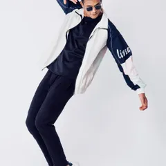 A dynamic action shot of a male model in athleisure wear. Capturing movement is key for activewear brands to show the functionality and fit of their clothing.