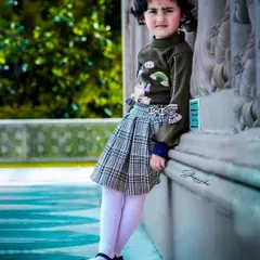 A full-length portrait of my daughter, showing her confident pose and stylish outfit. This kind of kids fashion photography is great for capturing their growing personality.