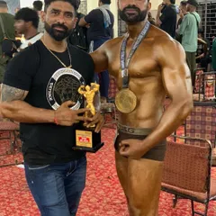 Proud moment with my student after he secured a top position. His success is a testament to his hard work and the effectiveness of our natural bodybuilding program.