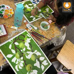 An overhead view of our studio table during a still life session. You can see students at different stages of their work, all receiving individual guidance.