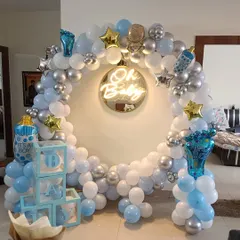 This is the full view of my popular 'Oh Baby' welcome home setup. It includes the circular balloon arch, neon sign, 'BABY' blocks, and themed foil balloons, creating a perfect photo corner in your living room.