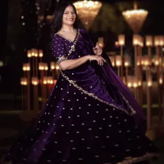 For a night of glamour and celebration, this opulent purple velvet lehenga makes a statement. It is hand-embroidered with a dazzling mix of pearls, dabka, and katdana for a truly stellar sangeet or reception look.