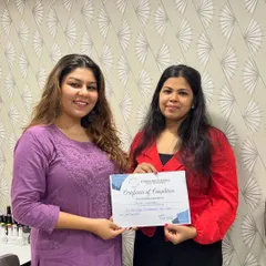 Here is Falguni receiving her certificate for the 20-Day Basic to Intermediate Nail Course. This program builds a strong foundation and introduces more complex techniques.