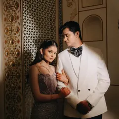 An elegant couple portrait from a royal sangeet in Ajmer. We focus on the connection between two people, using dramatic lighting and the regal backdrop of Pratap Mahal to create a timeless, editorial feel.