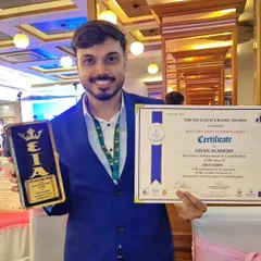 My partner and co-founder proudly holding our certificate and trophy for "Iconic Achievement & Contribution in the area of Education." This award belongs to our entire team and all our students.