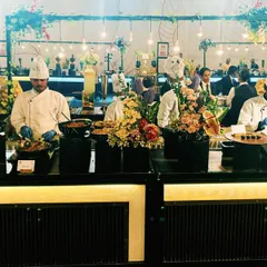 My team of professional chefs at a live counter, ensuring every dish is prepared fresh and served hot. We bring the energy and action of a live kitchen to your wedding or corporate event.