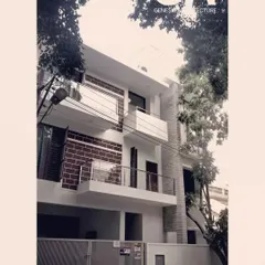 This residential building in HSR Layout uses a combination of exposed brick and white plaster. The design creates visual interest while honoring honest, simple materials, and the balconies provide private outdoor spaces for residents.