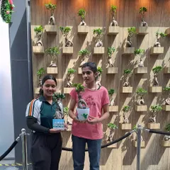 Happy participants at our pot painting and craft activity. We believe in fostering a love for plants and nature within the community through engaging and creative events.