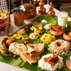 A modern interpretation of the traditional Onam Sadhya. We styled this feast on a banana leaf with elegant copper bowls and minimalist props, creating a clean and sophisticated look that respects tradition while fitting a contemporary restaurant's aesthetic.