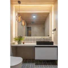 This bathroom blends rustic and modern styles. I used beautiful Moroccan-style patterned tiles for the floor and backsplash, paired with a wooden ceiling for warmth. The large backlit mirror and floating vanity keep the overall feel contemporary.