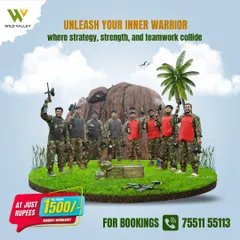 Unleash your inner warrior with your team at our Guts & Glory combat arena. This is a shot of a corporate team gearing up for a strategic paintball battle, a perfect activity for team building and fun.