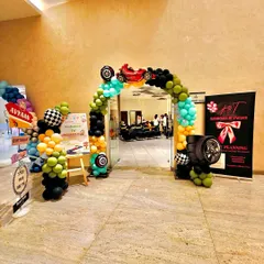 A dynamic car-themed entrance arch for Avyaan's birthday. I used tires and checkered-flag-patterned balloons to create a racetrack feel right from the moment guests arrive.