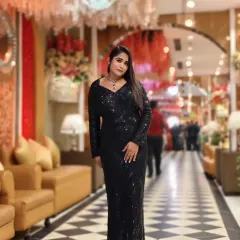 A full-length shot in a stunning black sequin gown. This is my go-to look for high-end award nights and gala dinners, where glamour is a must.