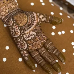 A close-up view of the name 'Ashu' integrated within the floral and paisley patterns. This is a special touch I love adding for my clients.