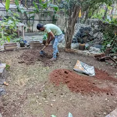 Here is the backyard before we began our work. Our first step was to clear the area and add three inches of nutrient-rich garden soil.