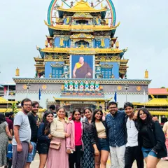 A group visiting the Namdroling Monastery, also known as the Golden Temple, in Coorg. My itineraries often include diverse cultural sites, from ancient temples to peaceful monasteries.