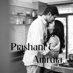 A black and white portrait from an in-home shoot. This image captures a quiet, intimate moment in the couple's own kitchen, showing that love is found in everyday life.